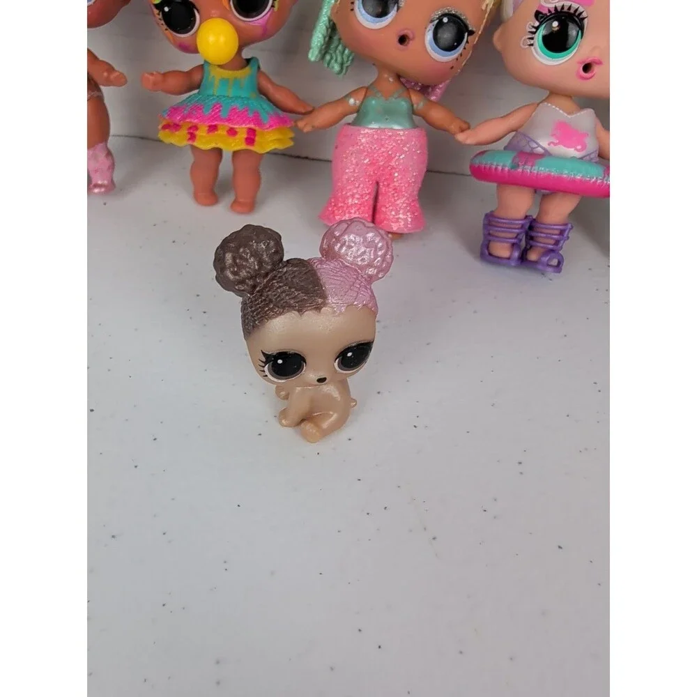 Lot of 8 LOL Surprise Dolls And Pet